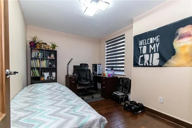 a bed room with a bed and a book shelf
