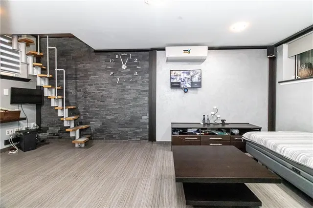 a bedroom with a bed and furniture