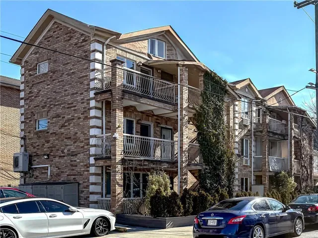 a view of a car parked in front of a building