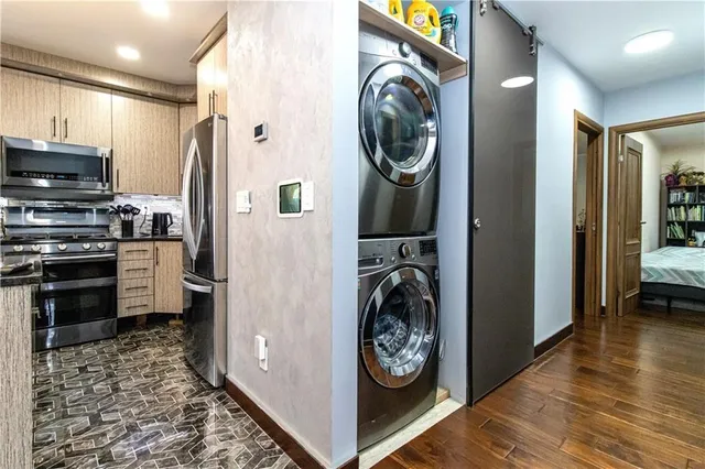 a view of a kitchen with washer and dryer