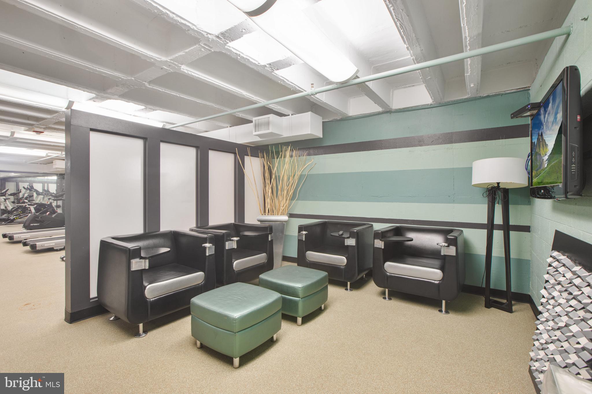 1101 3rd Street Southwest, Unit 403 Washington, DC 20024 - Photo 28 of 73 a living room with furniture and a large window
