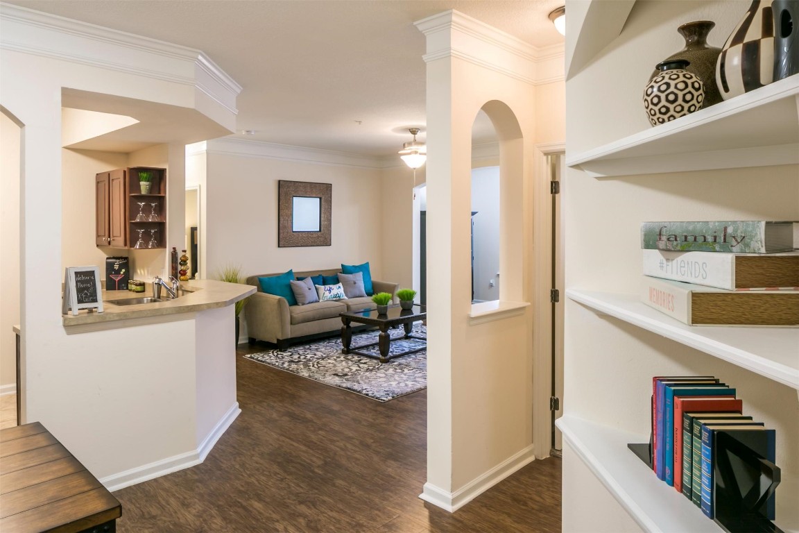 15270 Voss Road, Unit 733 Sugar Land, TX 77498 - Photo 2 of 13 a living room with furniture and a flat screen tv