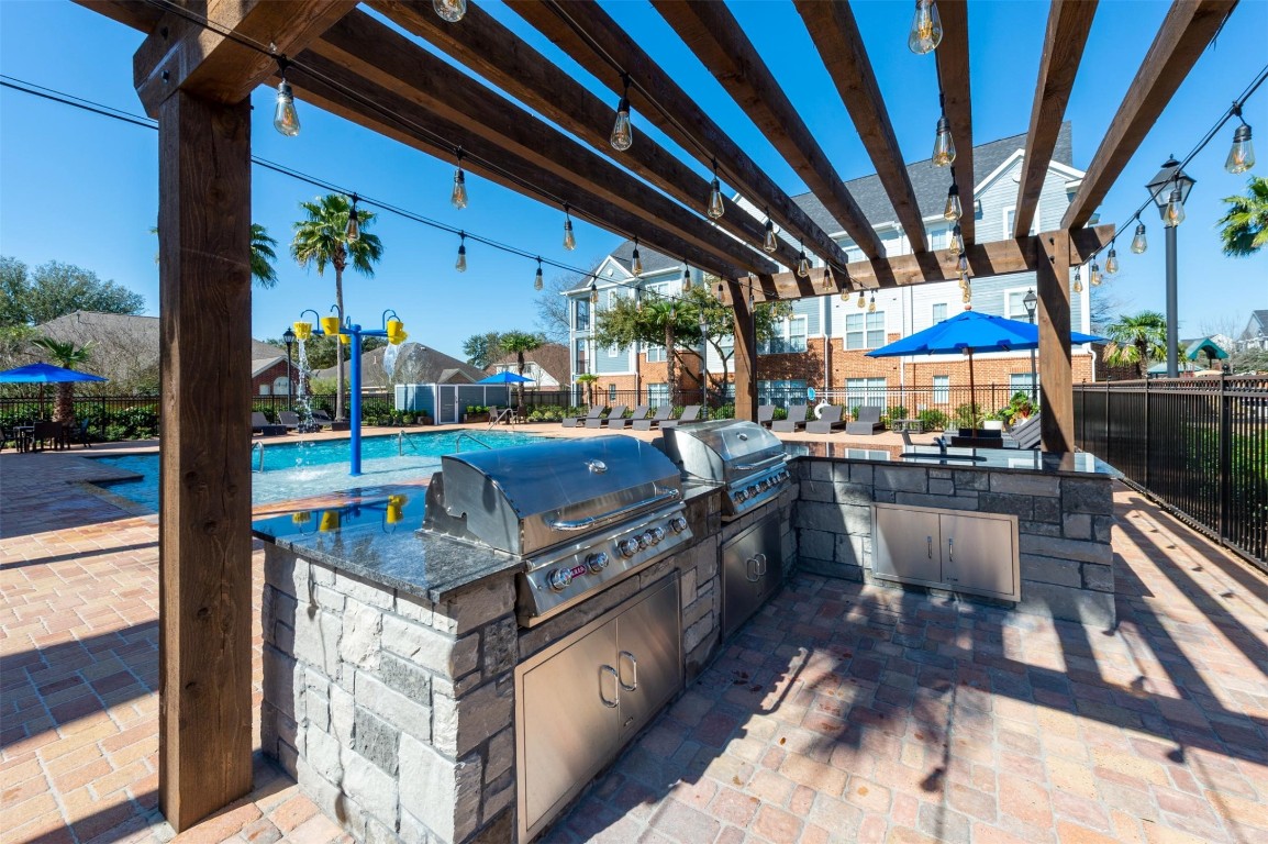 15270 Voss Road, Unit 733 Sugar Land, TX 77498 - Photo 7 of 13 a view of outdoor space with seating area