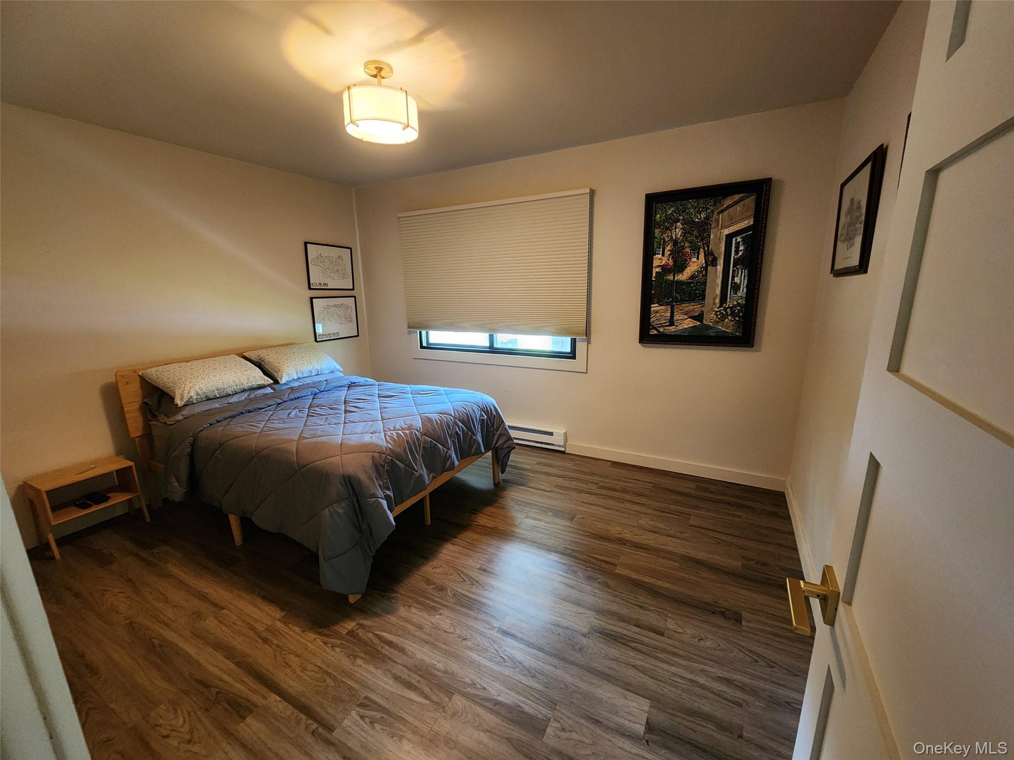 53 Lake Pleasant Road Staatsburg, NY 12580 - Photo 21 of 34 a bedroom with a bed and a window
