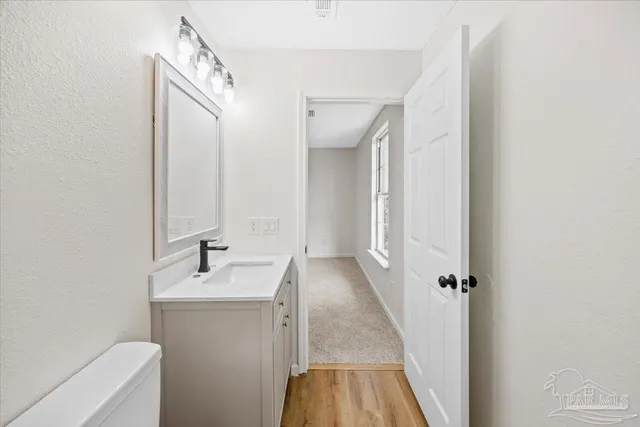 a bathroom with a sink a toilet and a bathtub
