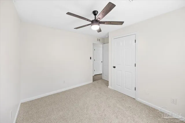 a front view of a house with swimming pool garden and outdoor seating