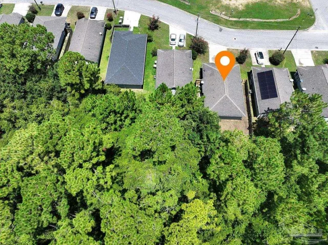 a swimming pool with lawn chairs and outdoor view