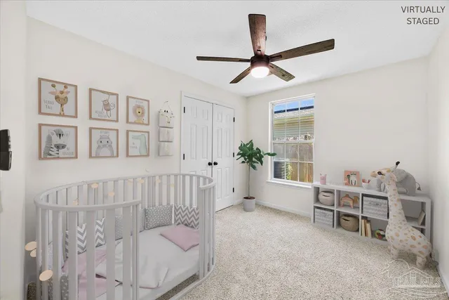 a bedroom with furniture and a window