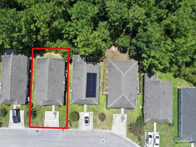 a bathroom with a toilet sink vanity granite and shower
