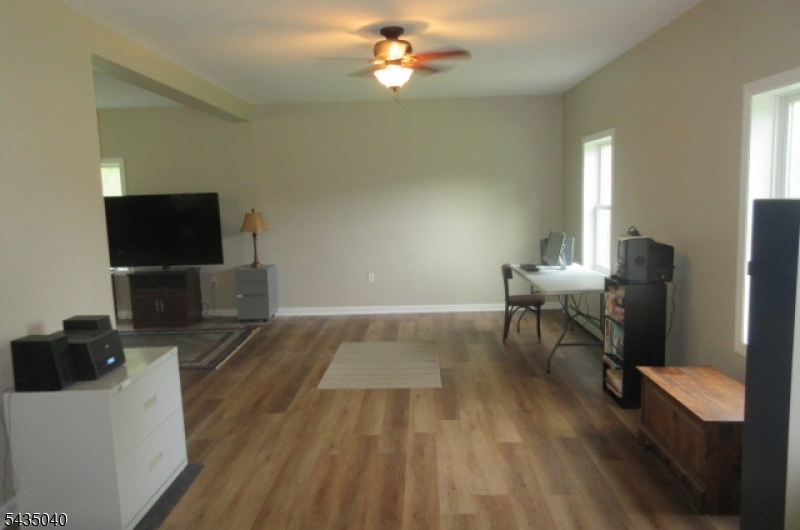 28 Beaver Run Road Lafayette, NJ 07848 - Photo 26 of 36 a living room with furniture and a flat screen tv
