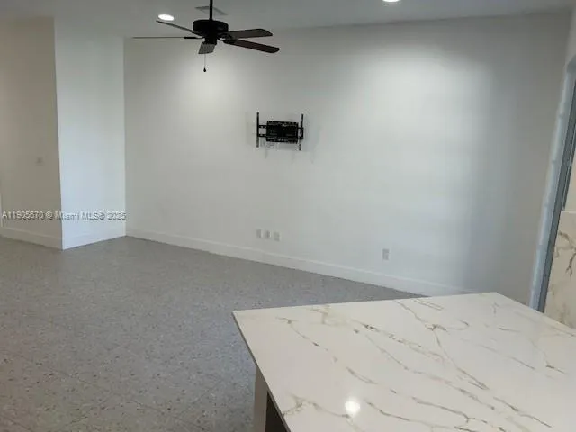 a kitchen with a sink cabinets and a window