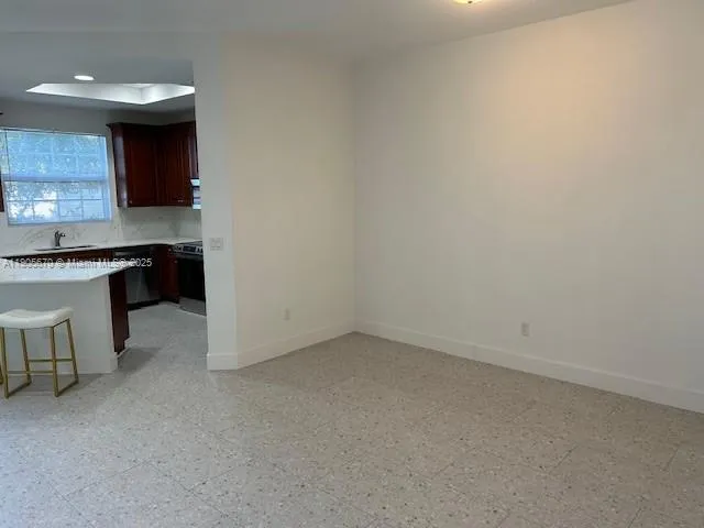 a view of a backyard with large trees