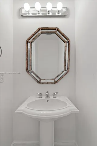 a view of staircase with white walls and a window