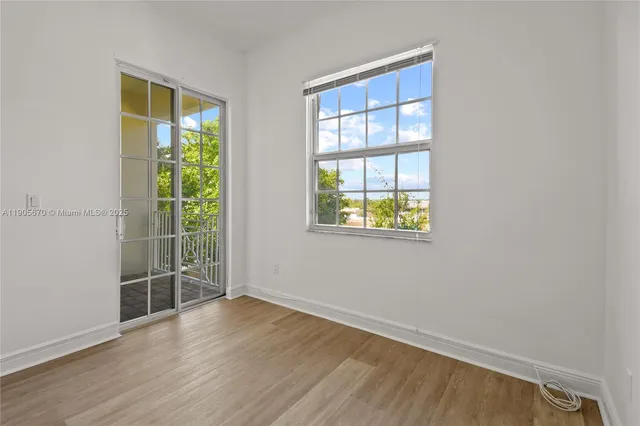 a view of staircase with wooden floor and fence