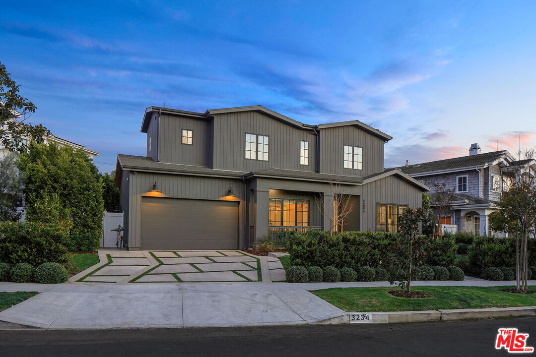 3234 Woodbine Street Los Angeles, CA 90064 - Photo 1 of 1 a front view of a house with a yard