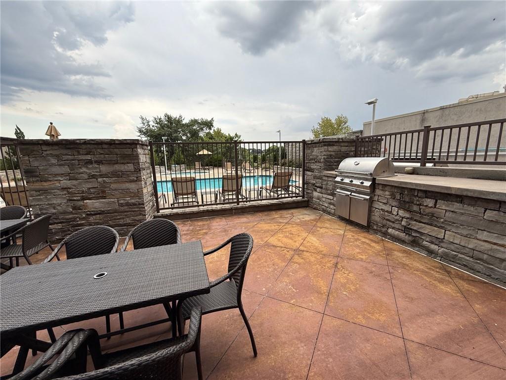 2255 Peachtree Road Northeast, Unit 322 Atlanta, GA 30309 - Photo 24 of 25 a terrace of a house with outdoor seating