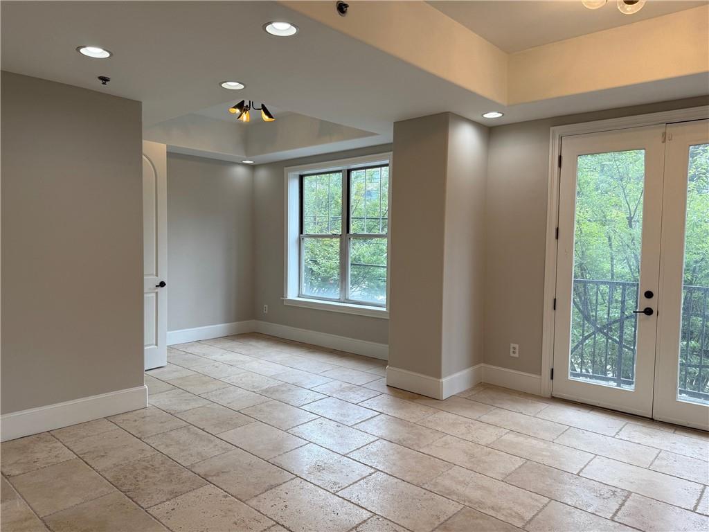 2255 Peachtree Road Northeast, Unit 322 Atlanta, GA 30309 - Photo 6 of 25 a view of an empty room with a window