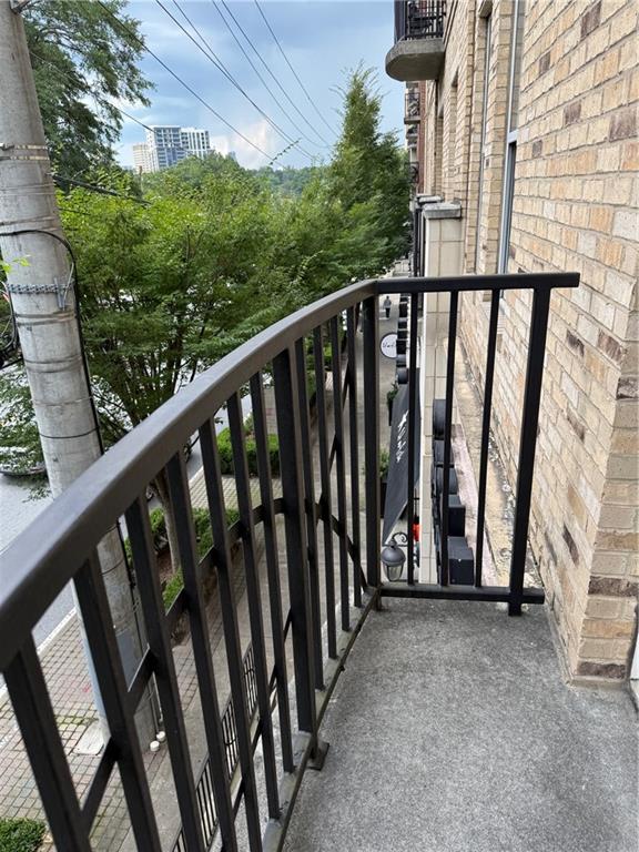 2255 Peachtree Road Northeast, Unit 322 Atlanta, GA 30309 - Photo 7 of 25 a view of a balcony with wooden floor