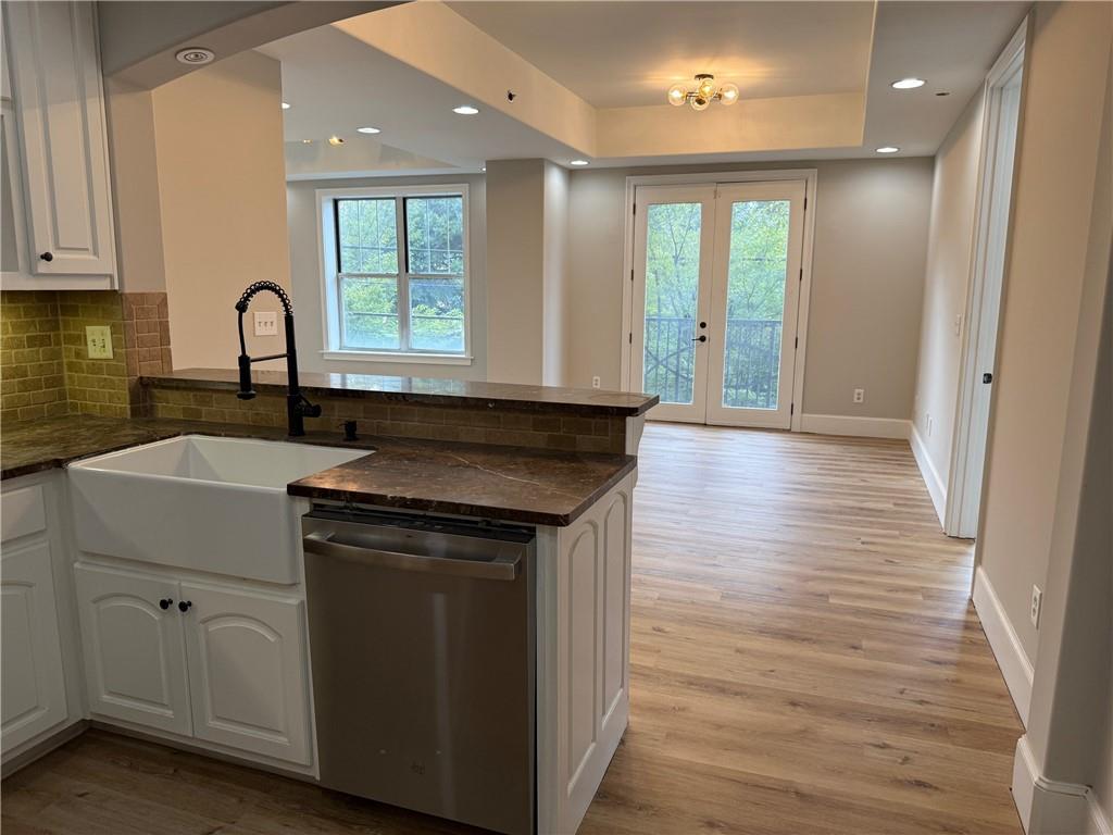 2255 Peachtree Road Northeast, Unit 322 Atlanta, GA 30309 - Photo 8 of 25 a view of a kitchen sink with wooden floor