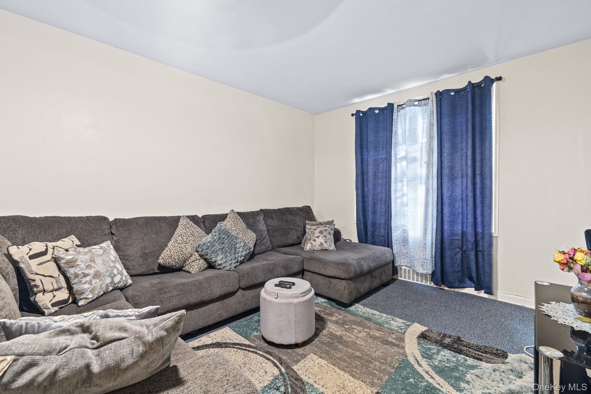 2105 Wallace Avenue, Unit 5A Bronx, NY 10462 - Photo 12 of 15 a living room with furniture and a window