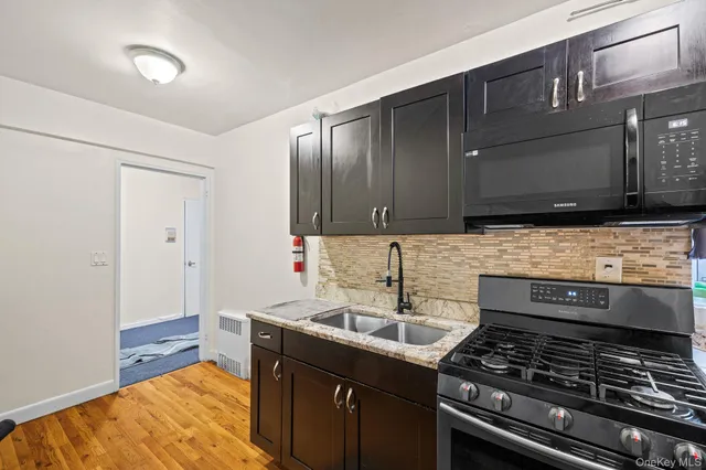 a kitchen that has a sink and a stove
