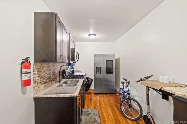 a utility room with sink dryer and washer