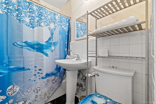 a bathroom with a sink a mirror and shower