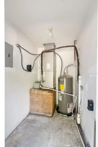 a view of storage and utility room with wooden floor