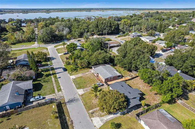 an aerial view of a house with a yard