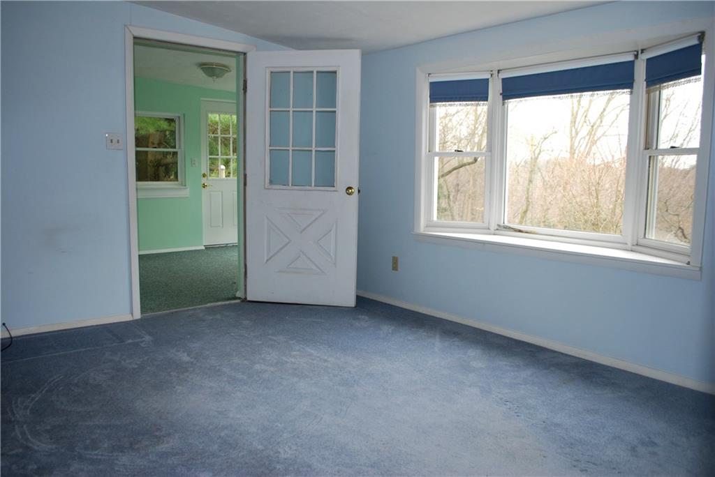 250 Crestmont Road Pittsburgh, PA 15237 - Photo 18 of 23 Living Room of In-law Suite. Private access via Stairwell from Deck, OR Interior Stairs from Main Level of Home.