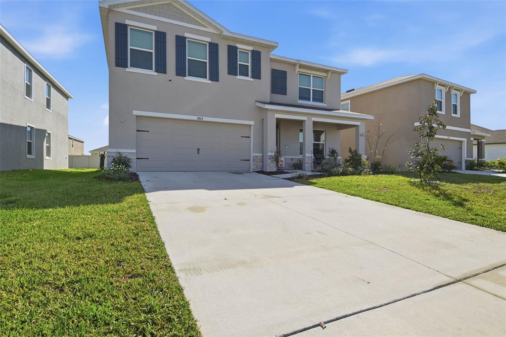 3844 Sunny Spring Street Plant City, FL 33565 - Photo 1 of 26 a front view of a house with a yard
