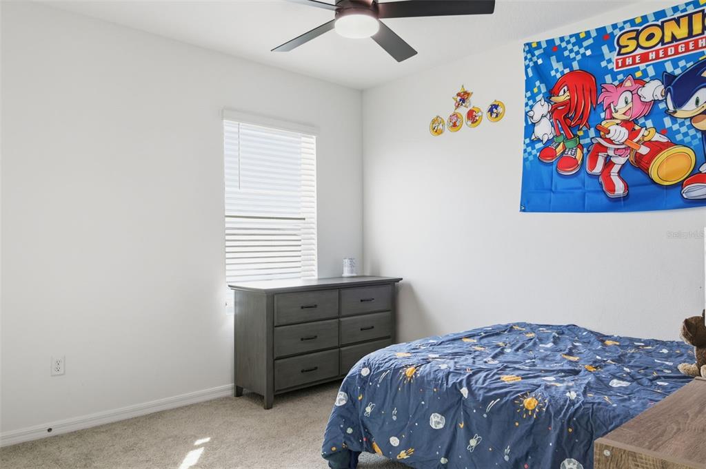3844 Sunny Spring Street Plant City, FL 33565 - Photo 15 of 26 a bedroom with a bed and a window