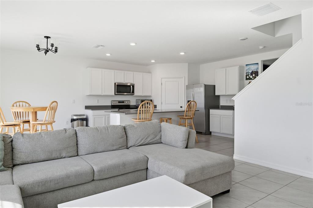 3844 Sunny Spring Street Plant City, FL 33565 - Photo 19 of 26 a living room with furniture and a couch