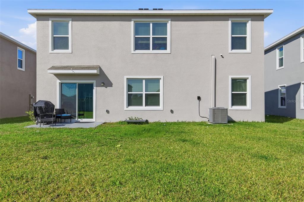 3844 Sunny Spring Street Plant City, FL 33565 - Photo 20 of 26 a view of a house with backyard porch and garden