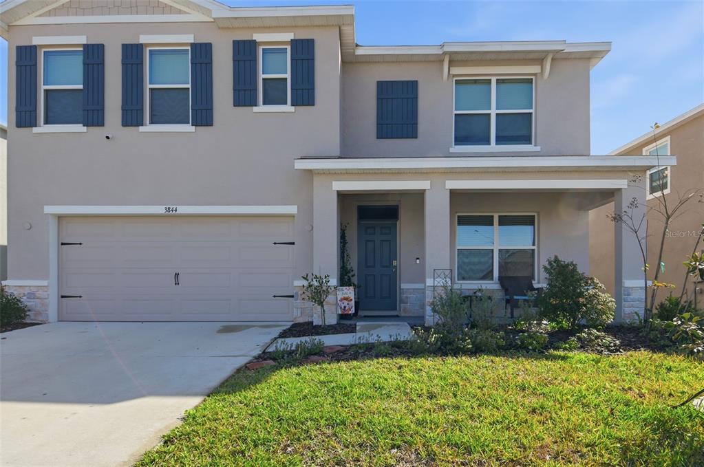 3844 Sunny Spring Street Plant City, FL 33565 - Photo 2 of 26 a house view with a garden space
