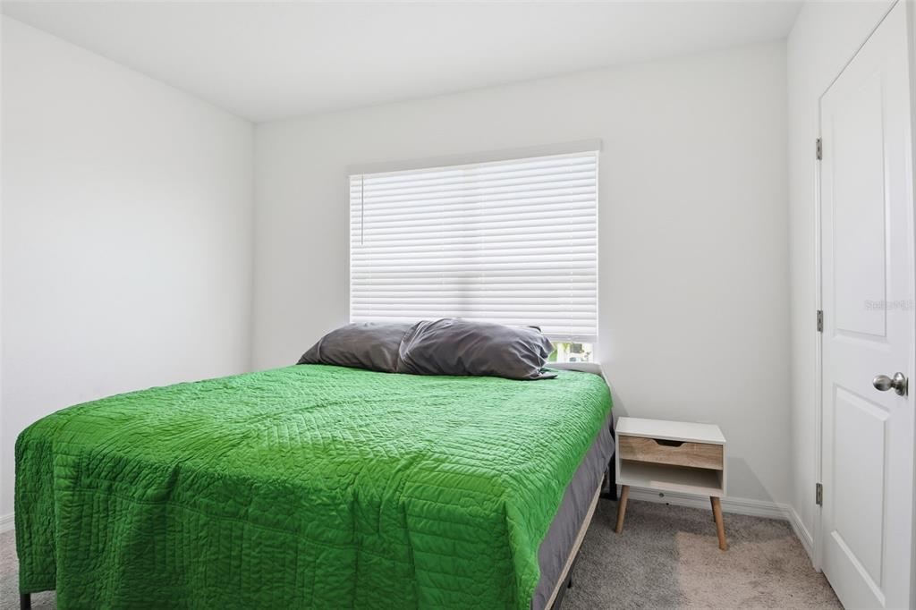 3844 Sunny Spring Street Plant City, FL 33565 - Photo 24 of 26 a bedroom with a bed and a window