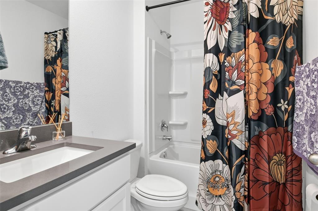 3844 Sunny Spring Street Plant City, FL 33565 - Photo 8 of 26 a bathroom with a sink toilet and shower