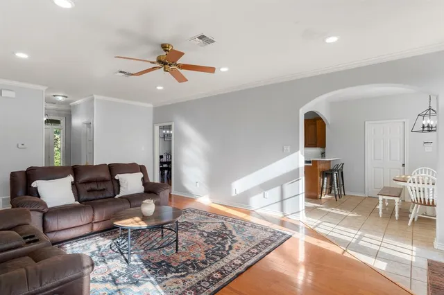 a living room with furniture and a rug