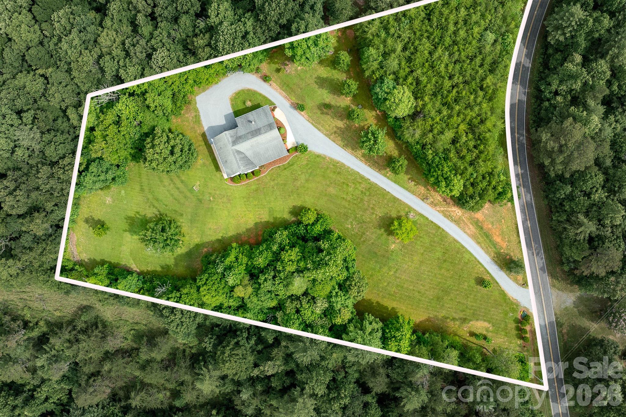 1697 Windswept Ridge Road Marshall, NC 28753 - Photo 2 of 48 a view of a yard