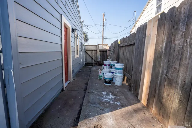 a view of a porch with couches chairs and potted plants