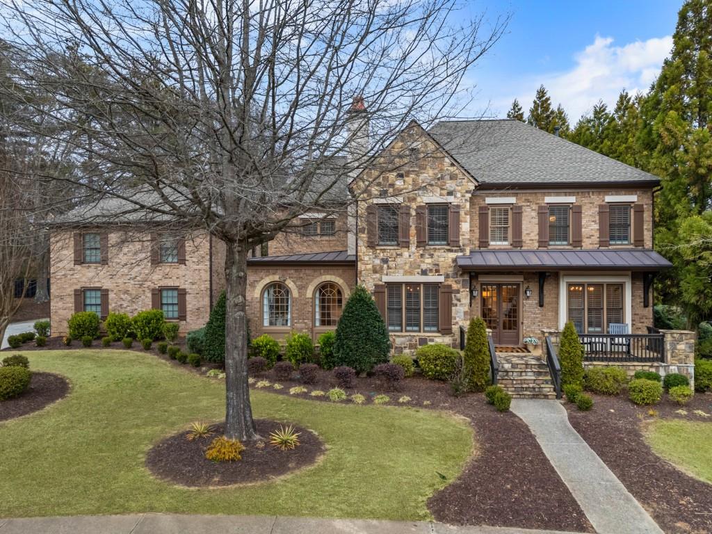 1052 Gramercy Lane Alpharetta, GA 30004 - Photo 1 of 1 a front view of a house with a yard