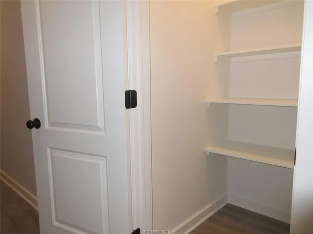a view of an empty walk in closet