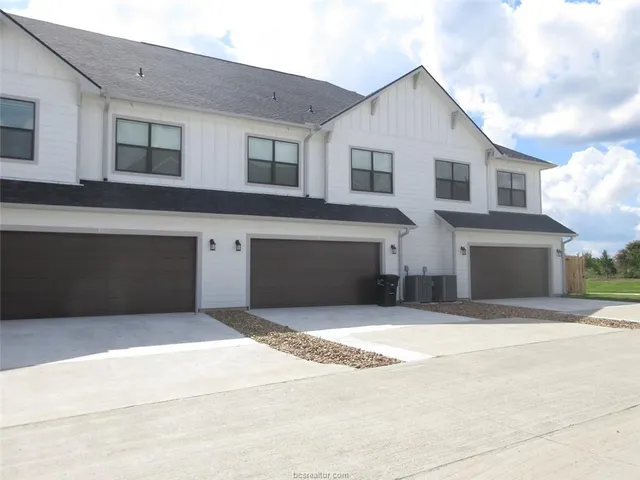 a front view of a house with yard