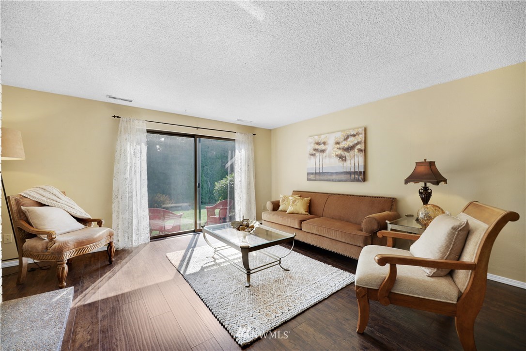 21529 4th Avenue West, Unit C33 Bothell, WA 98021 - Photo 14 of 35 a living room with furniture and a large window