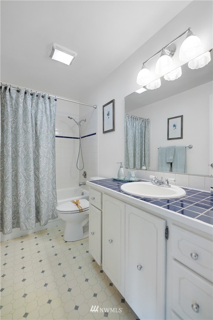 21529 4th Avenue West, Unit C33 Bothell, WA 98021 - Photo 22 of 35 a bathroom with a sink a toilet and shower