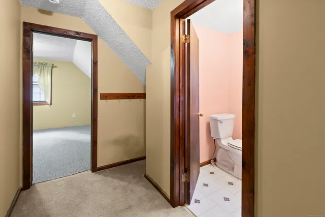 a view of a bathroom from a hallway