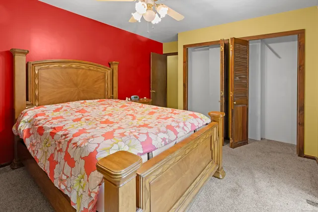 a bedroom with a bed and a closet