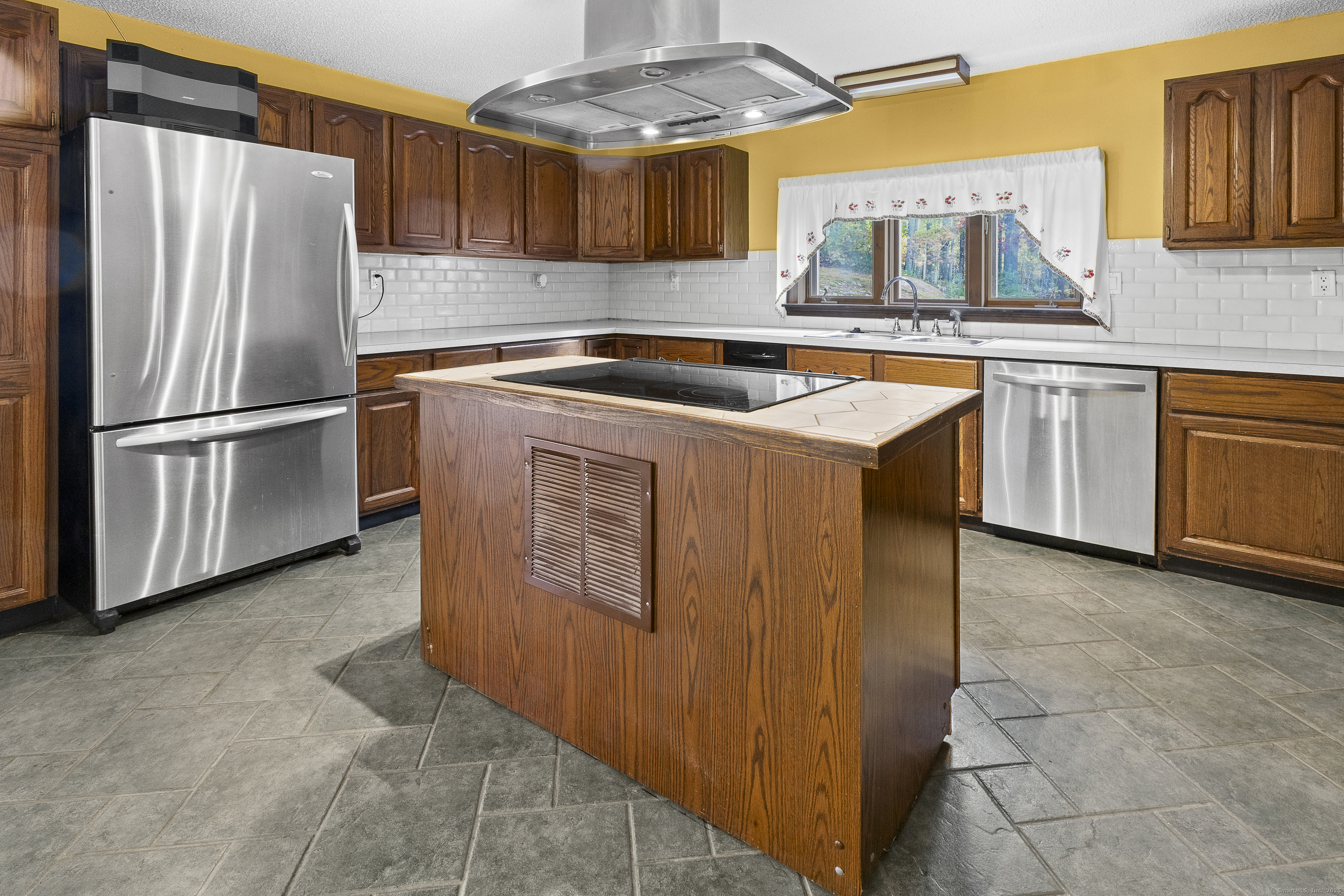 160 Munyan Road Putnam, CT 06260 - Photo 2 of 36 a kitchen with stainless steel appliances granite countertop a refrigerator a sink a stove and a microwave oven