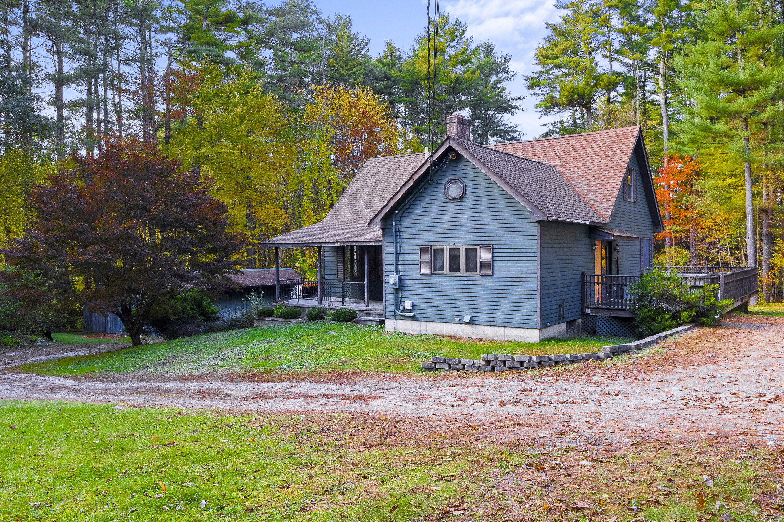 160 Munyan Road Putnam, CT 06260 - Photo 27 of 36 a front view of a house with a yard table and chairs