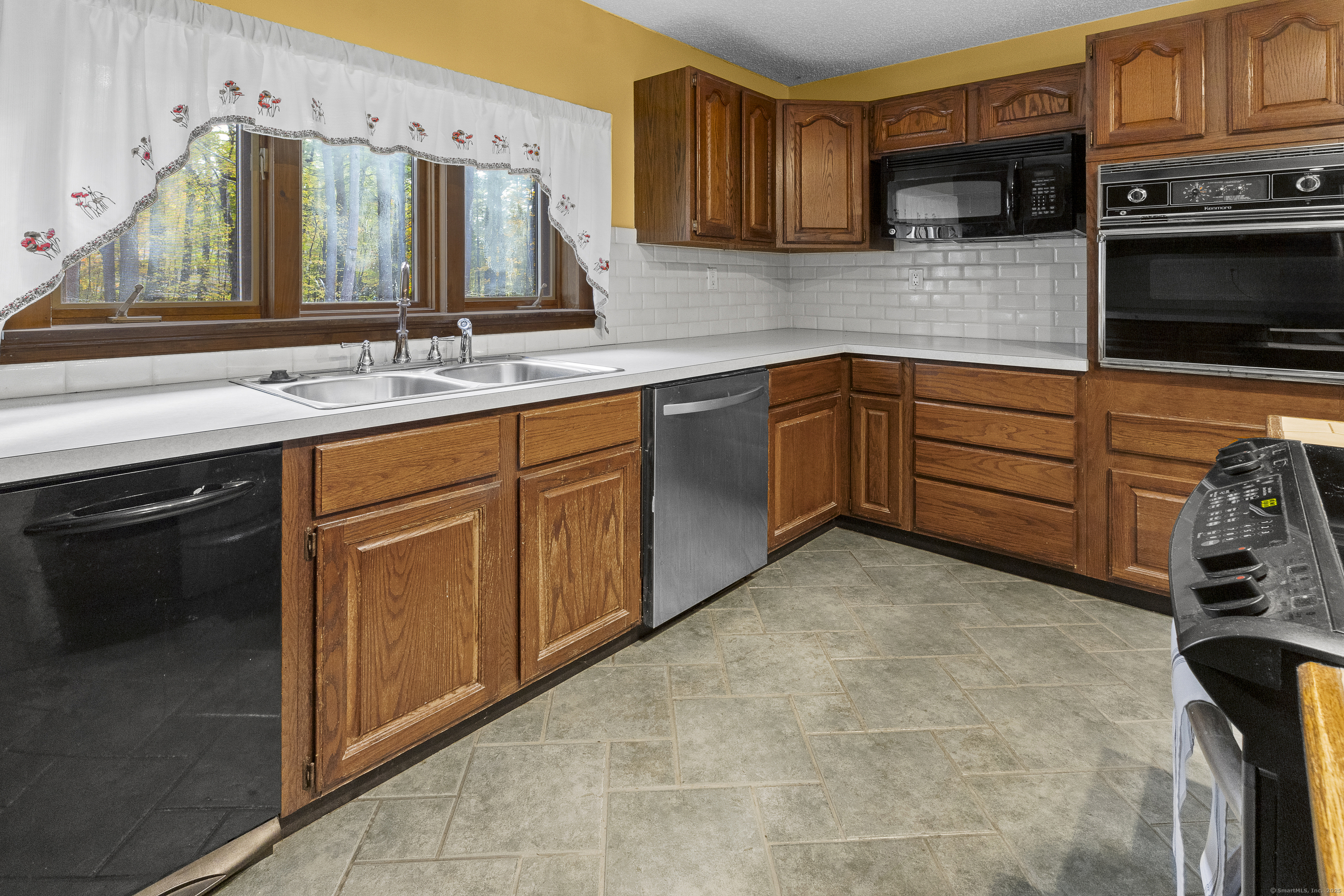 160 Munyan Road Putnam, CT 06260 - Photo 3 of 36 a kitchen with stainless steel appliances granite countertop a sink and a stove